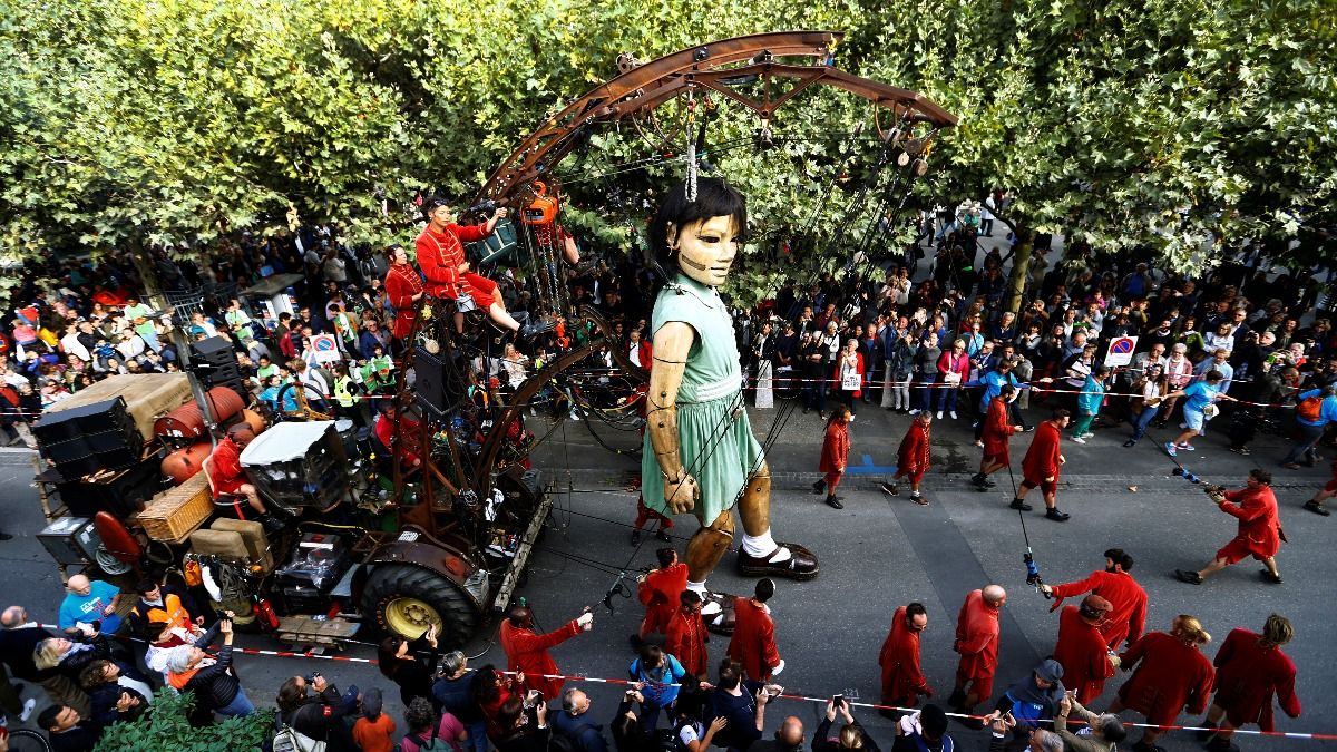 INSIGHT Giant puppets walk Geneva streets Reuters Video