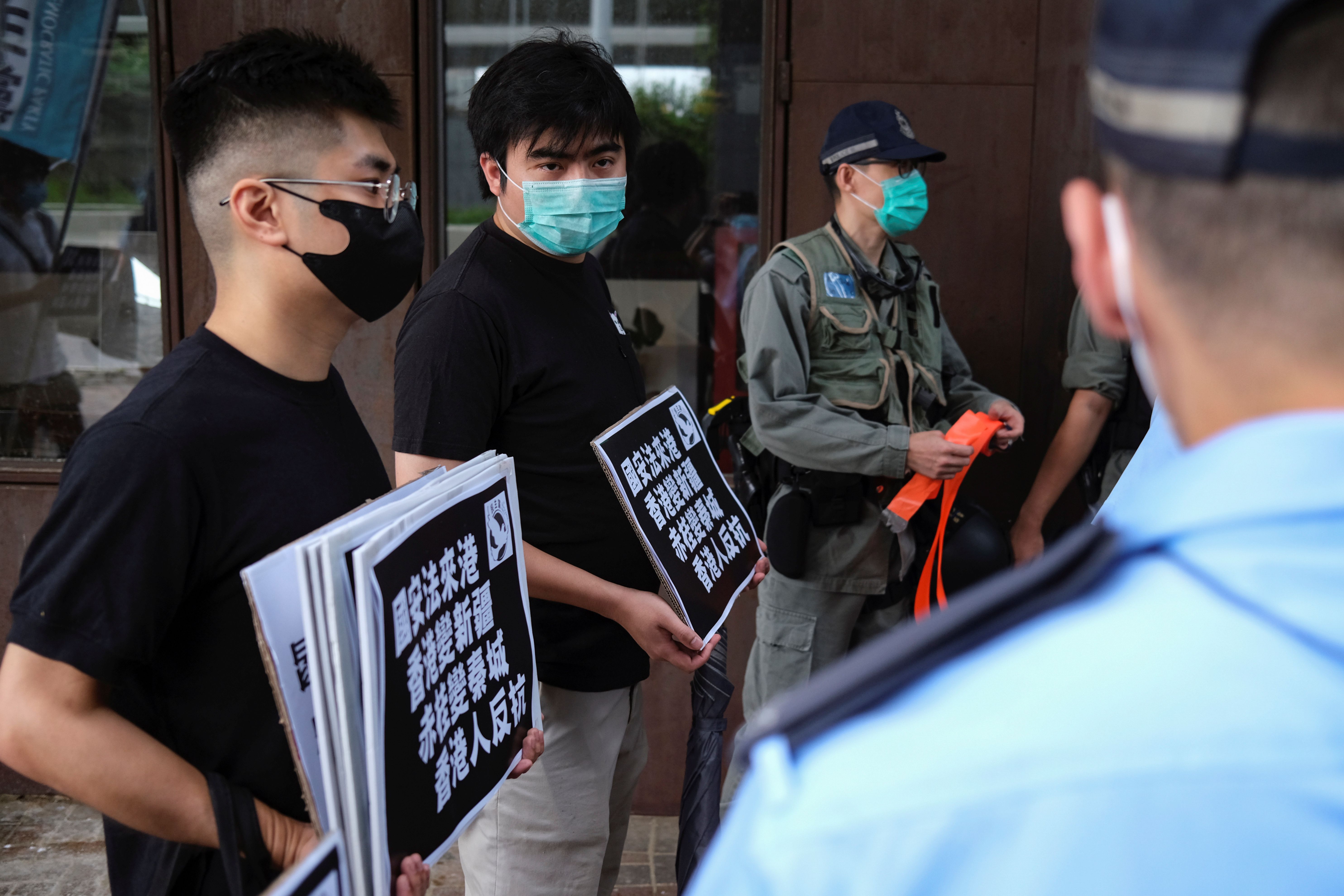 Activists call for Hong Kong to rise up against new security laws | Reuters