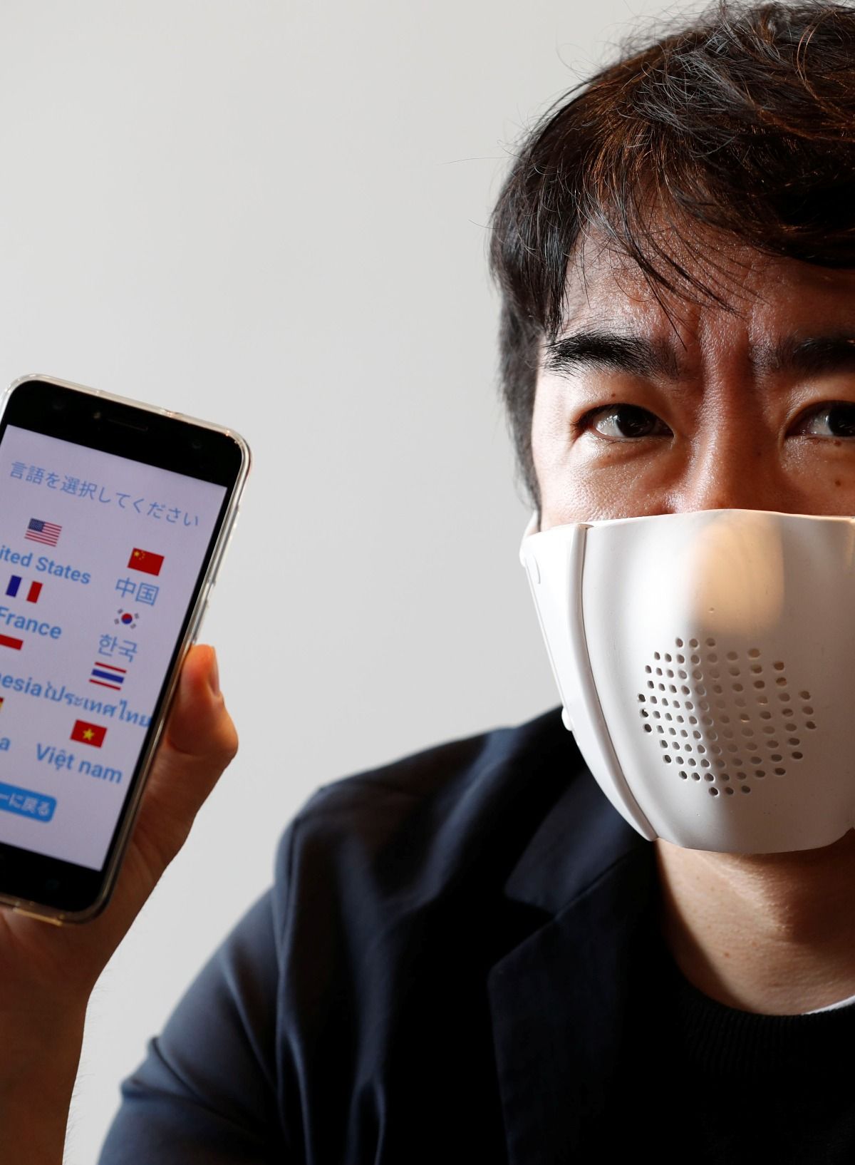 Smart face mask that translates eight languages | Reuters