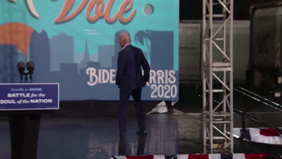 Biden runs off-stage as rain cuts rally short | Reuters