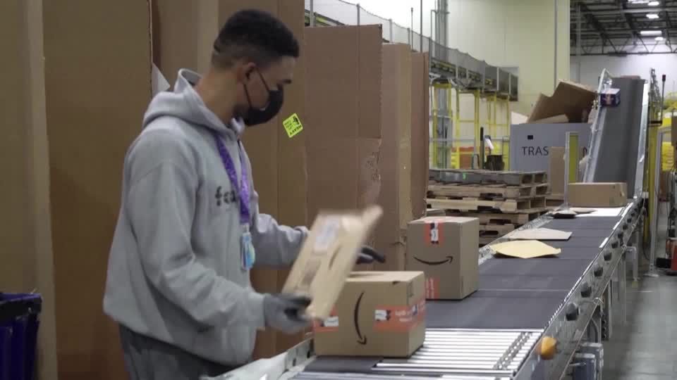 Amazon to ease mask rules for vaccinated staff | Reuters
