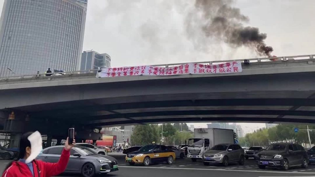 Rare political protest banners removed in Chinese capital | Reuters