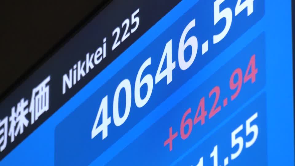 Japan shares scale record high, yen rebounds as Fed out-doves BOJ