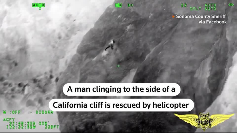 Man clinging to California cliff rescued by helicopter | Reuters