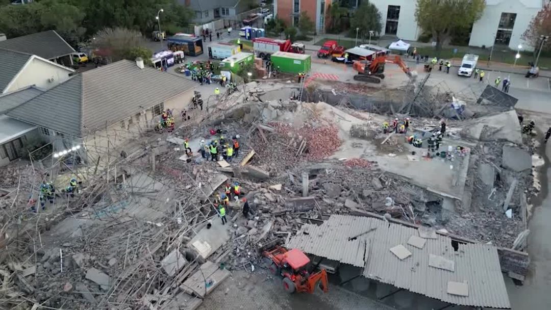 Rescuers search for survivors after South Africa building collapses ...