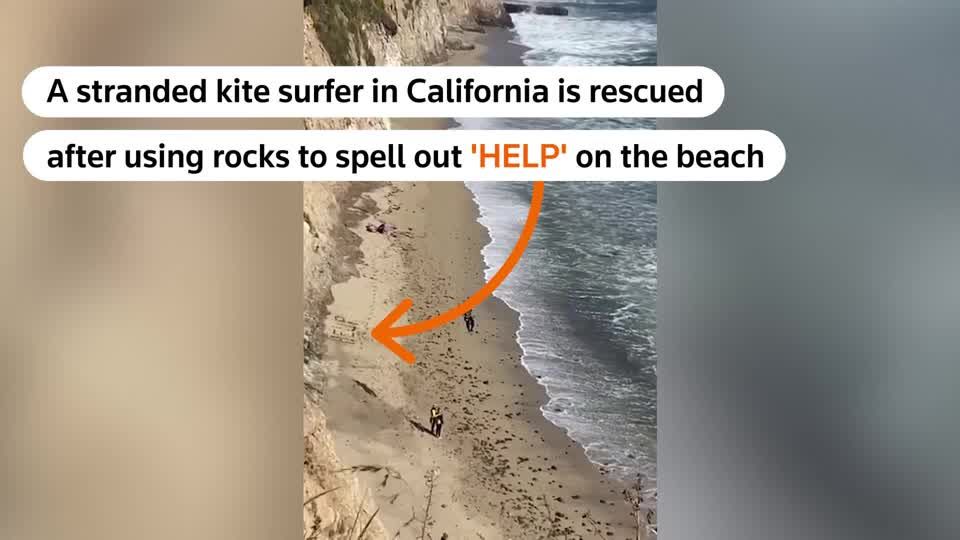 Stranded kite surfer rescued after spelling out 'HELP' on beach | Reuters