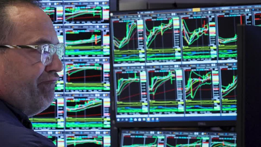 Stocks close higher after Fed cuts interest rates | Reuters