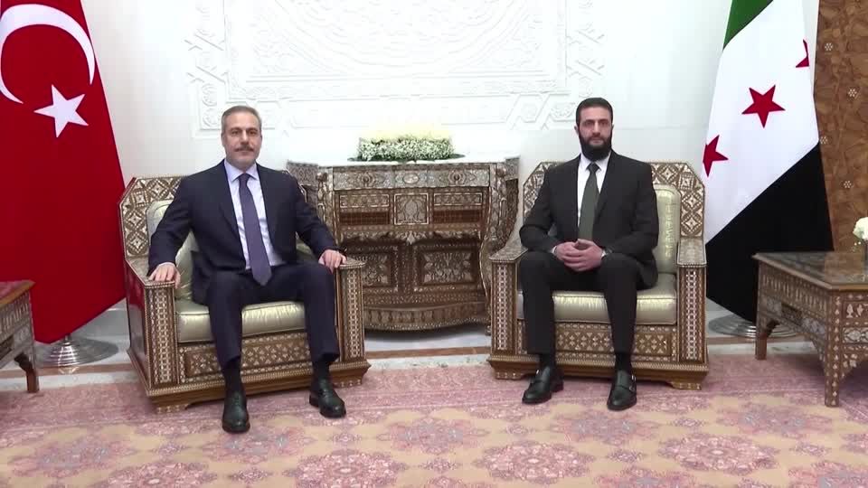 Turkey's foreign minister meets with Syria's de facto ruler | Reuters