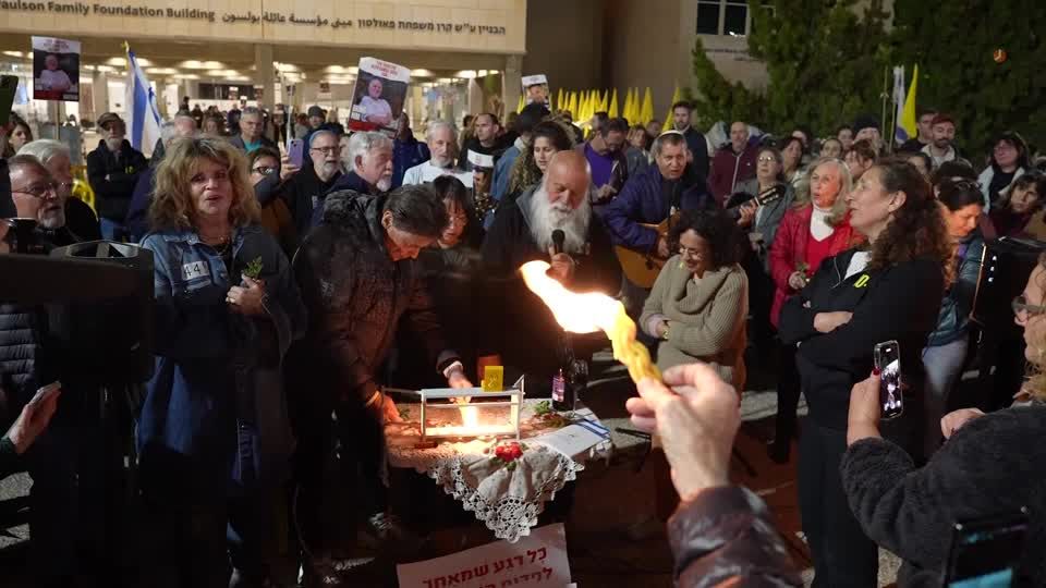 Families of Israeli hostages light Hanukkah candles