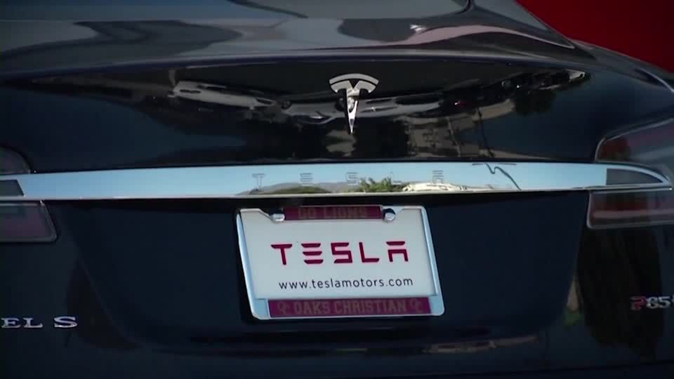 US opens probe into 2.6 million Teslas over remote driving | Reuters