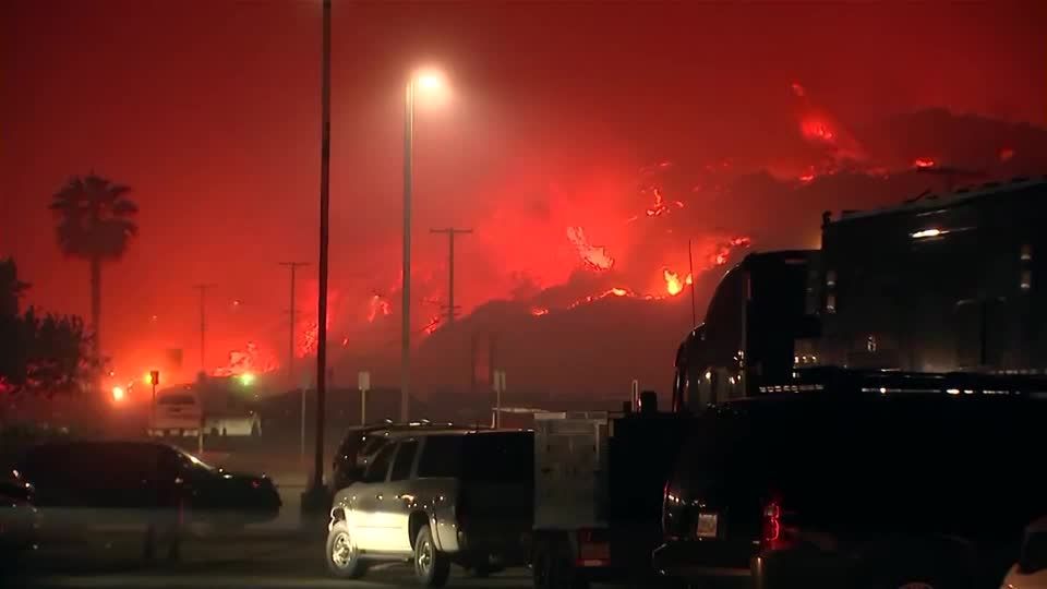 Wildfire rages through upscale Los Angeles area, forcing evacuations