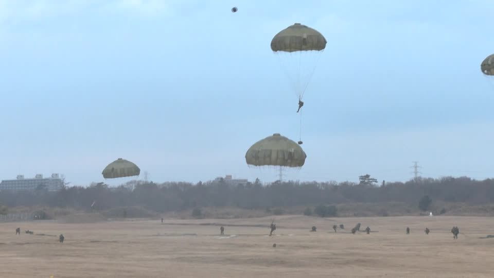 Japanese, US paratroopers leap from aircraft in annual drills | Reuters