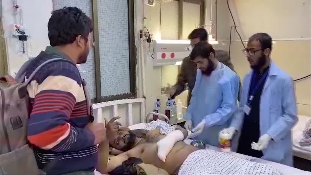 Pakistan train attack survivors 'crouched for hours' to survive | Reuters