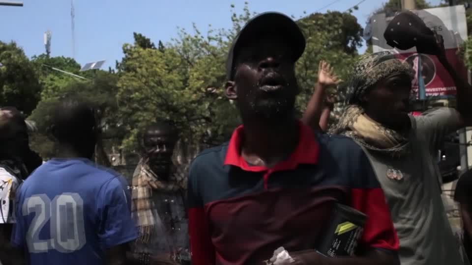 Haitians take to streets, demanding protection from gang violence