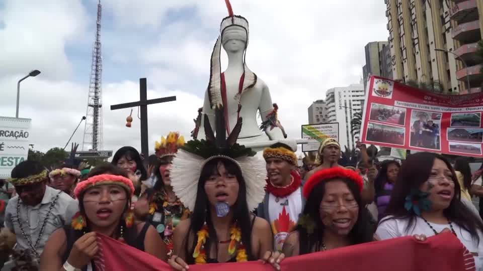 Indigenous groups rally in Brazil's capital over land rights | Reuters