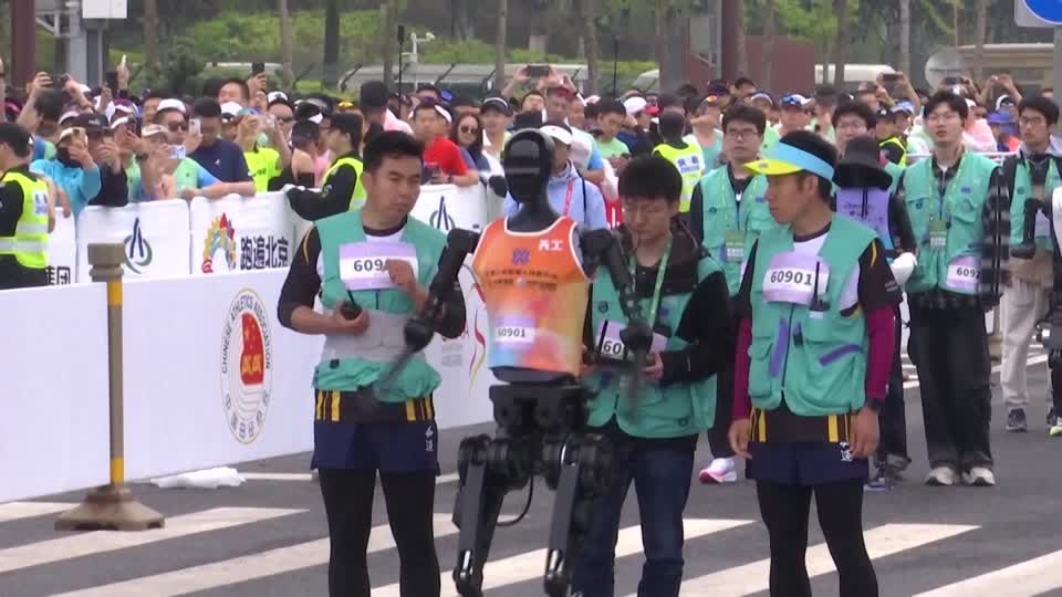 Humanoid robots race humans in a half-marathon in Beijing | Reuters