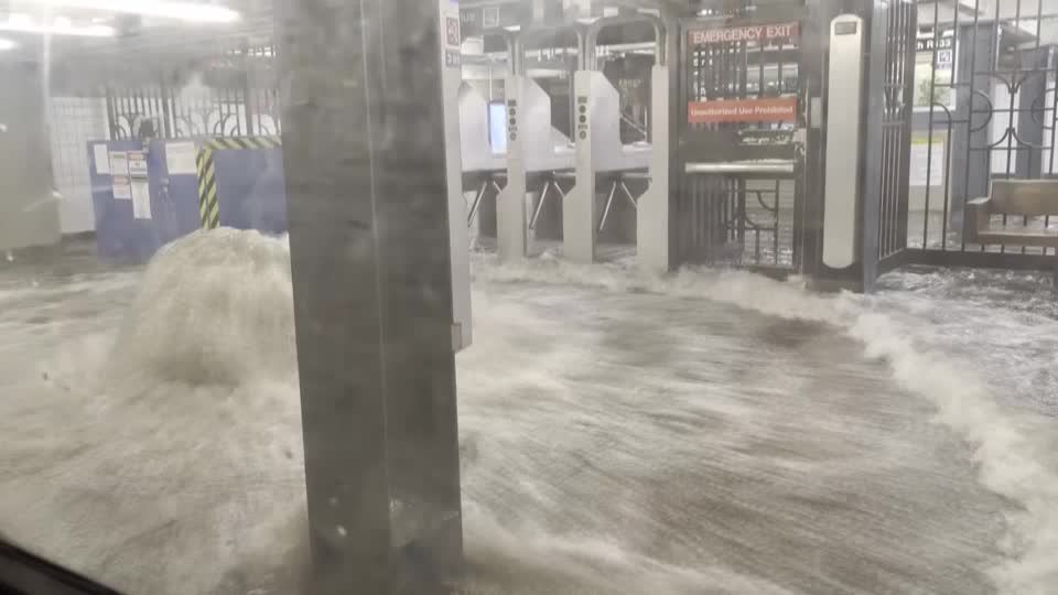 Floodwater gushes into New York subway station during heavy rain | Reuters