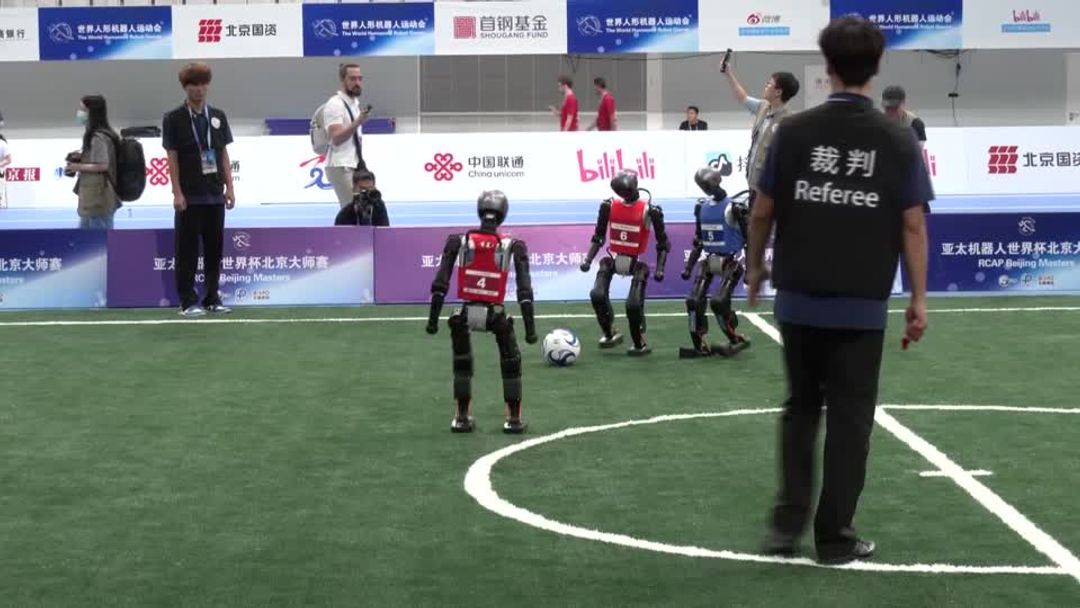 Humanoids crash, box, and race at China's 'robot Olympics' | Reuters