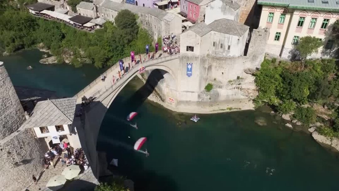 Divers leap from Stari Most bridge in the Cliff Diving World Series ...