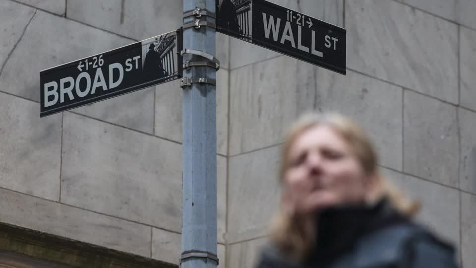 Wall Street ends lower ahead of Fed rate decision | Reuters