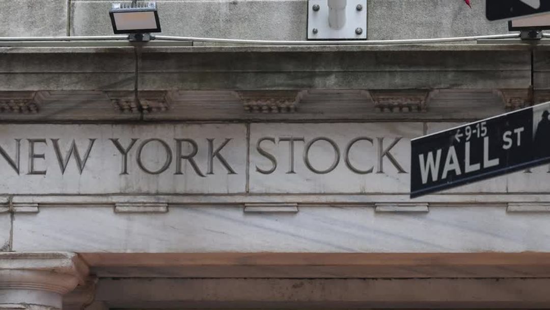 Wall Street indexes end lower as investors weigh Powell comments | Reuters