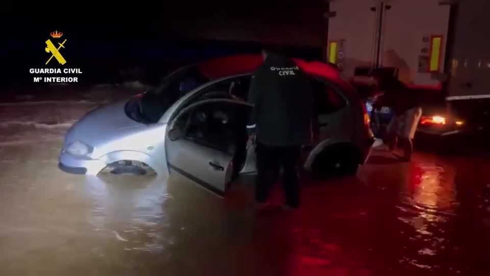 Police rescue people trapped in cars after Storm Alice hits Spain | Reuters