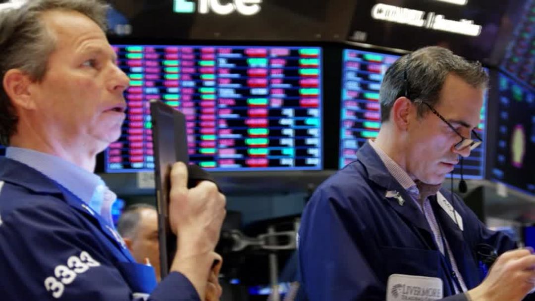Wall Street ends mixed as earnings lift the Dow | Reuters