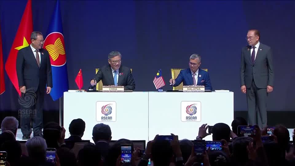 China and ASEAN, hit by US tariffs, sign upgraded free trade pact | Reuters