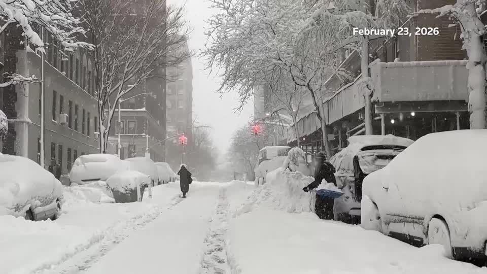 New Yorkers embrace 'once in a lifetime storm' as snow blankets city ...