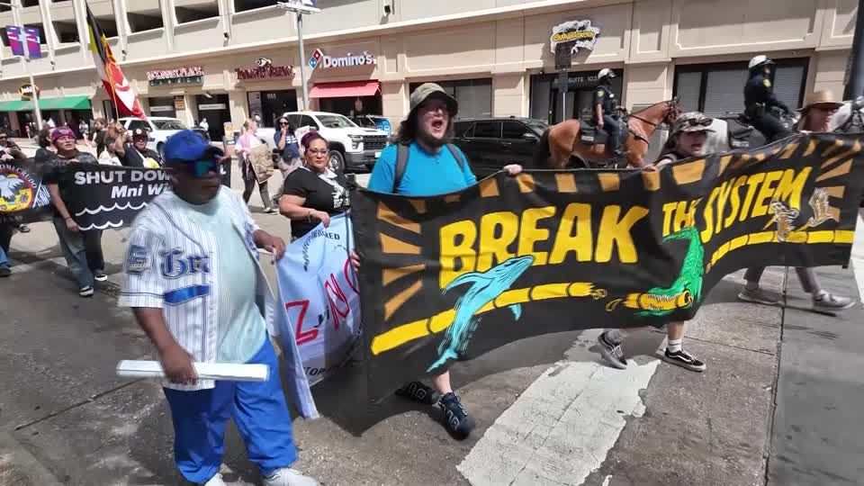 Hundreds protest fossil fuels at CERAWeek energy conference | Reuters