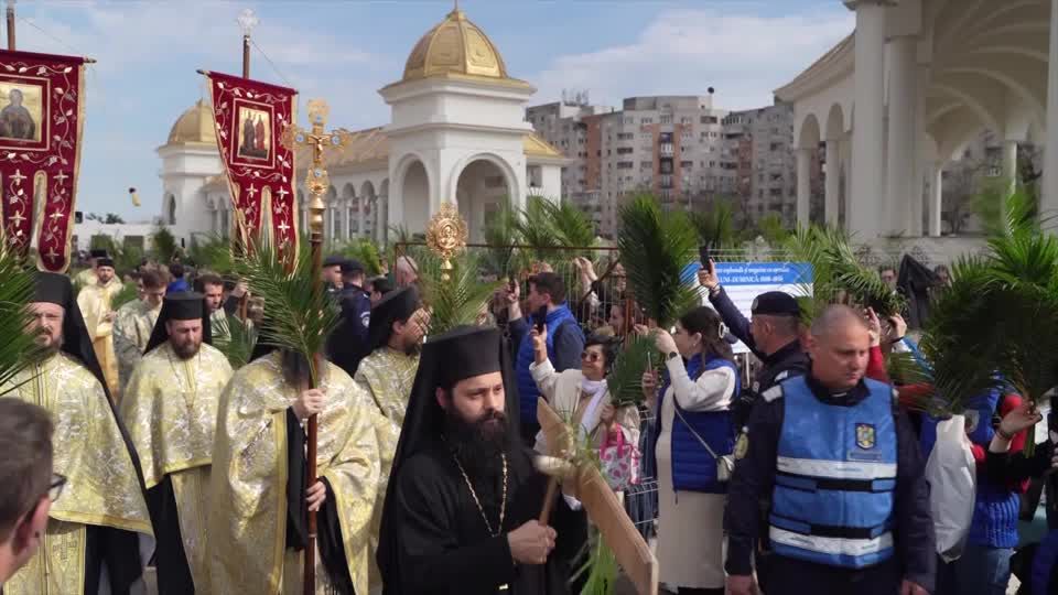 Orthodox Christians march through Bucharest for Palm Sunday | Reuters