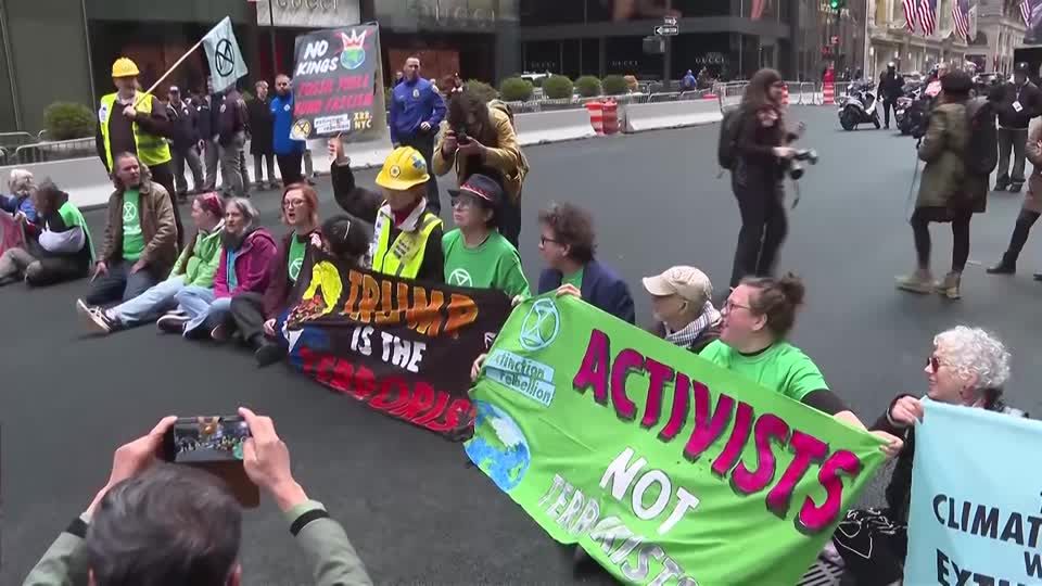 Arrests made at Earth Day protests outside Trump Tower | Reuters