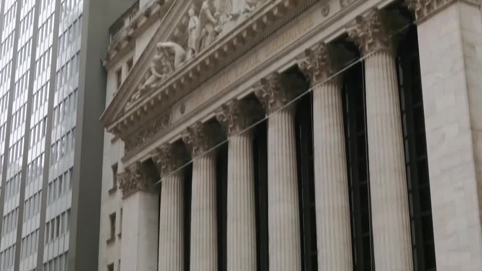 Wall Street ends lower as chip stocks give up gains | Reuters