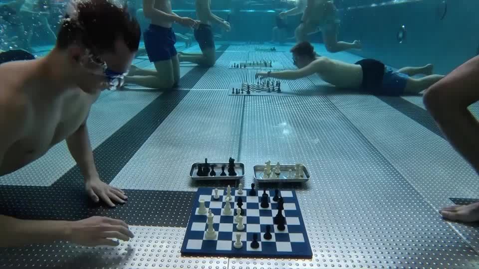 Diving chess players battle it out on underwater boards | Reuters