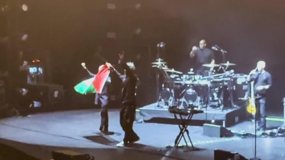Two members of Massive Attack were issued with stern warnings and barred from re-entering Singapore after the British band ended their ‌performance in the count
