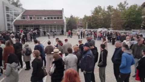 'Hopeful' voters queue for hours to vote in Serbia's historic election ...