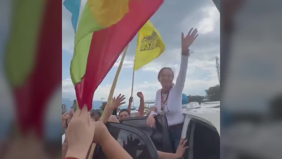 Opposition leader Machado greets supporters after returning to ...